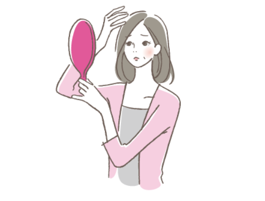 鏡を見る女性